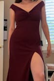 The color is so beautiful and the material is of great quality. I love the over-the-shoulder look and the slit is in a perfect place where it actually shows off your leg. I've had other dresses where the opening is in a weird spot where you don't actually see the leg but this one is perfectly placed. The material is slightly stretchy so it is very comfortable to move around in. The off-the-shoulder also had a material that prevent them from sliding off so it stays in place more easily. I have a wedding to attend this weekend and can't wait to wear this dress. - Bianca C.
