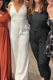 I got this jumpsuit for my wedding's after party. IT WAS PERFECT! I got so many compliments on it (more than my dress!) I wore 3" heels with it and it fit perfectly on the ground. I normally order a medium but I felt like a large was better since I wasn't sure if I would bloat from the dinner and drinks and the after party. I plan on keeping this jumpsuit and wearing it for anniversaries in the future! - Nikki F.