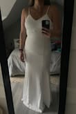 I originally sent my measurements and they were right between two sizes. So I had to exchange for a smaller size. When I got the medium it fits my body in all of the right places and it was just long enough even though I'm pretty tall. I think especially for the price this dress is really nice quality. I'm
Super excited for my wedding day. - Emily C.