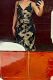 I fell hard for this dress as soon as I put it on - it's so dramatic, classy and special. But I noticed immediately that it fits strangely around the stomach area - there is a pooch of material and it tends to bunch up around the hips when you walk or move. I loved it so much I wore it anyway, but I was uncomfortable all evening. I might take it to the tailor to get that pooch taken in for the next time I wear it. And for my short girlies - the straps can be taken up but the back still dragged on the ground for me& in a dramatic way! Something to be aware of, though - it could be taken up a couple of inches. - Eva S.