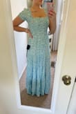 I purchased this dress for my "something blue" bridal shower and it's PERFECT. The print is beautiful, the fabric is high quality and it has a lot of stretch as well. I am 5'5, 135 pounds with a 36B chest and originally ordered a small, but the straps were way too loose and kept falling down. It was also very long (even in heels it dragged) so I exchanged for an XS and it fits perfectly. - Nicole K.