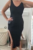 Loveeee this dress! Been wearing it as a swim cover up! Will wear it for casual dinner dates in the summer too! 
The slit is high and fun. The ribbed fabric is amazing. I sized down and it is perfect. Usually a large and got a medium. - Tia M.