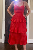 I saw this dress and I had to have it. I don't usually wear red, but I decided to give it a shot. It's such a pretty red! I originally ordered a medium because I wasn't sure what size to get, but it was way too big in the chest. I exchanged it for a small and it fits perfectly. - Katie M.