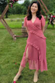 I bought this dress to wear to a semi formal wedding in the summer. I love how flowy and lightweight it is, and the slit is a very nice touch to show a little skin without being too revealing. I did have to use fashion tapes for the bust area because it can open up when you bend over, and the waist area is a bit loose so I wish it could be a bit more form fitting. Overall, a very beautiful dress and I received a lot of compliments on it! - Crystal Z.