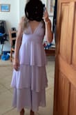 Very cute and perfect for a wedding but the sizing was a little weird. I'm usually a size small in dresses but I had to size up to a medium because I couldn't get the small zipped up. The zipper is not smooth and the under bust area is a little tight, but once I got the dress on it was perfect. I also have a smaller bust and this dress still flattered me! I really loved the way it looked. - Morgan K.