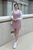 Bought this dress for my trip to London. Almost returned because of the sizing, but glad I kept it! I ordered a small and medium, the small fit perfect on top but was a little tight on the bottom, and the medium fit perfect on the bottom but was way too big on top. I ended up keeping the small, and I wore a long sleeve mock neck underneath and it was exactly the look I was going for! Additionally, I was surprised when I opened it to see that it was actually woven with shiny, multicolor tinsel that makes the dress sparkly. I think it's more noticeable in person and I wouldn't necessarily say it was a good or bad thing, just unexpected since I don't think the dress comes off that way in the picture. - Megan R.