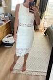 I ended up keeping this to wear to our private wedding ceremony although I need the top taken in. Would fit a bigger bust. - Ali J.