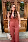 I loved this jumpsuit! I wore it for a brunch for my birthday and it was perfect. I am tall and the length still went to the floor with heels on. I wanted it to be a little looser/more flowy with this fabric so I sized up to an XL, but if you want it to be more form fitting, pick your usual size! I got multiple compliments on it. Made very well and looks as pictured! The color is gorgeous and the asymmetrical straps are such a unique touch. Highly recommend. - Lauren S.