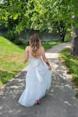 This is dress DREAMY. It's flowly and not heavy. Easy to move in and so flattering! I received so many complaints wearing this! - Nicole M.
