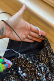 I just received this and was very excited about it. Unfortunately, I tried it on and noticed it felt uneven. Upon further inspection, I noticed that the strap wasn't through one of the loops. I will be returning - Justine R.