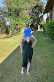 I was unsure if this dress would fit because I'm in between a small and a medium usually. I got the small and it was great. It is stretchy. Very flattering all over. I did have to wear petals and use fashion tape to make sure everything stayed in place but that is to be expected. Another girl at the wedding I went to was wearing the same dress in Sage! We both loved it! Don't hesitate to buy. - Abigail B.