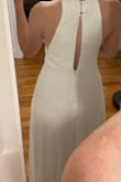 First, let me say I LOVE this dress. The lace detail on bodice/neckline and peekaboo back are very flattering and the material falls around your waist and hips so elegantly. I do wish there were a few more sizing options besides S M L. I first ordered the medium and it felt too big, especially in the bust and waist. Then ordered the small but it was a tad too tight on my ribs and the keyhole back was straining open a bit instead of laying in its natural position. I ended up returning the small and keeping the medium and I had the top taken in an inch or two on the sides. For reference, I normally wear a small top and a medium bottom. - Anna L.