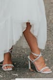 Wore these for my elopement. They were very cute and my something blue without being BLUE, if you know what I mean. I had the straps on the largest setting so if you have bigger ankles this might effect your fit. They photographed well. Would buy again! - Abigail O.