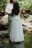 I wore this for my elopement. I was traveling up until the week before my wedding and honestly bought this as a back up in case I couldn't find something when I came to town but ended up loving it much more than expected! It was perfect for the occasion and I'm going to get it cropped above the knee for our party with family and friends on our 1 year and wear it again! The fit wasn't as snug around the bust as I'd like but that's clear in the model's photos too and I still felt beautiful in it. - Abigail O.