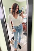 This top is super cute. I love the bell sleeves. I do wish the fabric was thicker. White is always hard with being sheer. This isn't terrible but a double layer would have been preferred. - Rachel B.