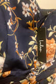 This was brand new with tags and ripped without even being worn- terrible quality for the price! - Jenna M.