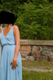 I bought this dress because my sister had it and I loved it. The front part is loose, but not super unflattering. I was able to comfortably able to wear it without a bra, and the sides both had slits and it was perfect for a summer wedding guest dress. - Eden L.