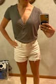 I love this top!! It's slightly versatile depending on how you tuck it in or wear it to show a little more cleavage and have a slightly sexier look, or cover up more to not show anything, so it can be worn for a range of things- family get together or afternoon date. Fits perfectly, as well. Plan to buy a second one in another color! - Kate T.