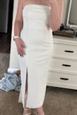 I got this dress for my rehearsal dinner and it fits perfect. The bow is pretty heavy but I think it should stay up all night. I can't wait to wear it! The material is so comfy too! - Lily B.