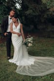 This dress fit absolutely perfectly. I was 26 weeks pregnant and didn't have to get a thing sized. No one could believe it was only $123 - Tianna I.