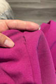 The zipper in the back of the pants is a pain in the a**, literally. Also, as soon as I put it on right before going to an event I found a hole right under the zipper. Had to do sawing in makeup and all. Not a pleasant experience. - Diana L.