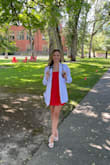 I got this dress for my white coat ceremony and loved it! It fit nicely without being too fitted. The neckline is perfect for something semi-professional. I tried an xs and found that it was a bit too small for me. The small was perfect and the tie-straps stayed in place the whole time. - Searra H.