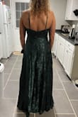This dress is so beautiful. And the color and material is so elegant. It's double-layered on the bottom for more volume. The slit is perfect and the top is so flattering. Fit just right - McKenzie M.