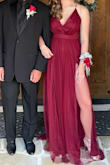 Bought this dress for my daughter's event, and she was stunning!! She was 15, so the slit was higher than expected (but fine - it's covered by the sheer layers), and she needed pretty high heels because it's long. She looked and felt elegant and beautiful!
It's also pretty LOW cut, so I sewed the front together about 2-2.5", and it was STILL low cut!! But it was fine. --You can tell I sewed it together real quick. :) She looked and felt amazing.
Absolutely one of the best gowns and incredible price for the quality. - Jill O.