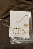 My necklace does not look like this. It came in 2 pieces. I thought maybe I needed to put it together. I haven't been able to do so.
I'm having to fill out "How's the fit" but mine does not fall into these categories. - Alma R.