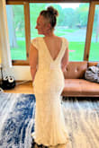Beautiful Dress! I ordered 3 dresses to try for my beach wedding in the fall. This was not my final choice, but was beautiful. Unfortunately, I feel my measurements fall right between a medium and large for this dress, so it did fit a little loose. I would still consider the fit "true to size". As with all the dresses I purchased, the materials are top quality, but do not give at all in terms of stretch. I ended up choosing a different dress for my big day, one that I could wear a regular bra with. But I cannot recommend Lulus enough! - Anika P.