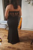 I really enjoy this dress, but the back doesnt have boning so the 'corset' back is just a visual accent. It looks very glamorous. Other than that its good and very pretty - Anna P.