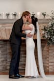 I ended up getting the dress altered to be slightly tighter & the train removed since I'm short and the dress ended up fitting perfectly after the minor alterations! The fabric was comfortable and high quality. - Mariah V.