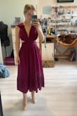 True to size measurements but the cut out bits can be a bit tight especially if youve eaten alot! Theres a zip at the back so keep that in mind as there is no give, but the colour and quality is worth the price. Adjust the ties at the back if its a bit tight round the front. - Jennifer H.