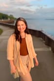 I love this top and have worn it over a dress, a swimsuit, and a casual summer outfit. I am normally a medium to large but with this being oversized the small fits me the way I like it. Great material for warm weather, it doesn't make me feel too hot. - Brittany V.