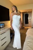 It fits my body perfectly!  I got some high heels and I was ready to go!  It's a very nice fabric, hugged my curves, and gave me a beautiful silhouette! Love be the opening in the back&gave it extra sexy! - Amy D.