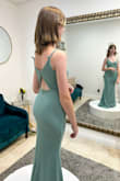 Bought this dress for my soon-to-be stepdaughter for our wedding. She's 12 years old, 5'4'', and around 100 lbs (guesstimating). This dress fit her like a glove! The fabric is luxurious, although the color in person looks different from the picture. The green is lighter, more on the blue-sea green side than the sage green in the photo. It definitely was too long, but I expected that from the reviews so got it hemmed. I wish the color was true to what was shown in the photos because now our greens for the wedding do not match properly. But for the price, the dress is beautiful regardless. - Jayde W.
