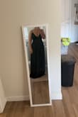 I bought this for my brother's wedding and it is perfect. The slit goes all the way up which I love. On dresses that have a slit that goes up to your thigh, it never looks right on me because I am short so it hits at my knee. I usually have problems with low-cut tops because I have bigger boobs but I feel like this supports me and makes my boobs look great! - Kourtnie B.