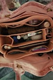 I love this bag. I cant afford the $3,500 Christian Dior bag but this one is better because I won't go bankrupt using it and the chain straps are really classy. I wish it had 2 holes at either end for a long strap for traveling but either way it's great. I got an insert for it off Amazon and I'm so organized. Sorry for my unprofessional photos. - Heather C.