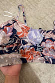 I really wanted to like this! Unfortunately, the fabric is very thin and looks (and feels) very cheaply made. The style of the top is not anything like what is advertised in the photos (Why are there holes underneath the bust??) The hook closure on the skirt is nearly impossible to use because it is flimsy and hidden beneath the seams of the fabric. The pattern is quite pretty in person, but when I spend over $70 on an outfit, I expect higher quality and more thoughtful design. - Grace N.