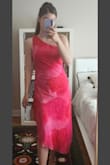 Other reviews say this dress doesn't snug your curves, I agree- but I'm not particularly curvy so the dress flows just right. Color and cut are great! There isn't any stretch in the fabric, so even though size small is a tiny bit loose, I wouldn't size down. - Ena R.