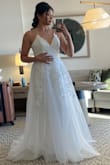 The dress is beautiful and for the price is a great deal. I'm 5'7" and wore heels and it was the perfect length but if I had worn flats I would've needed to hem it up. I wore this to my Hawaii beach wedding and all the layers in the wind looked great lol Just buy it and you won't be disappointed:) - Briana V.