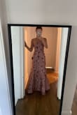 The lack of stretch makes the dress run small. I'm typically an XS but had to size up AND get it tailored (Small was too large). - Olivia S.