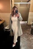 I wore this jumpsuit to dinner after my husband and I eloped. It fit comfortably and the length was just right (I'm short). I know a few comments warned that the breast covers seemed cheap which made me a little apprehensive to purchase it at first but that wasn't my experience. I could wear without a bra and you can barely see the covers unless someone was looking closely. - Anjelica M.