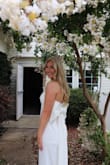 As my bridal shower approached, I searched high and low for the perfect dress that would not only make me feel radiant but also captivate the hearts of my closest friends and family. Little did I know that I would stumble upon a true gem - the strapless dress adorned with a charming bow! It's safe to say that this dress was an absolute showstopper and the highlight of my special day.

From the moment I slipped into the dress, I knew it was the one. The strapless design exuded sophistication and grace. The dress hugged my figure in all the right places, making me feel like a true bride-to-be. Absolute love!! - Caroline D.