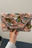 Love love love this purse. It has a gold chain that comes with it or you can just use it as a large clutch. Can fit a ton. Bought for bachelorette weekend nights out! - Samantha M.