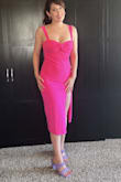 Got this to wear to the Barbie movie. It's fairly thick material and fully lined. The style and color are perfect. I find it a little snug in the hips but it's probably just my body shape vs the dress being a column style. The size small is true to size over all (I'm US size 4-6). The neckline is really cute and flattering. I don't love how high/wide the split is, but looking at photos of myself in it, it  doesn't look bad. - Michelle H.