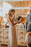 This dress was perfect for my body type. I had to get it slightly altered. I couldn't wear heels because I am taller than my husband, so I had a little taken off the bottom. I probably could have picked a better picture to show the dress, but this is what I have on my laptop. - Marcie P.