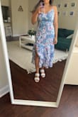 I am 5'4, 140 pounds, and ordered a medium. I carry my weight in my top half and often have trouble with my bust and shoulders fitting into things. This dress fits me well and is very flattering! Some other reviews say that the slip underneath is short, and it is. However, by design, it can't be longer because of the slit, and you can't tell once it's on. The fabric seems to be of decent quality. - Stephanie M.