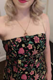 Originally ordered the medium, but was too small. Large fit better, but was a little loose in the bust. Great dress! Got lots of compliments! - Hayley A.