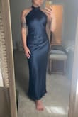 Im usually a true M, but the small fit me like a glove. I wear side 4/6 jeans and but smaller bust so I was worried it would not fit my hips. It fits perfect! It has a nice lining all the way down so its extremely flattering! - Katie U.